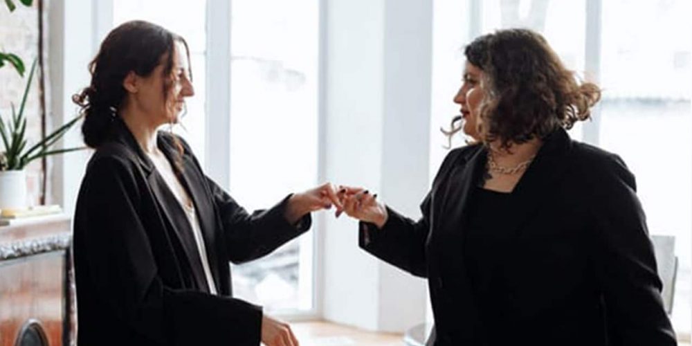Two Female Couple Smiling — McVittie Legal In Alstonville, NSW